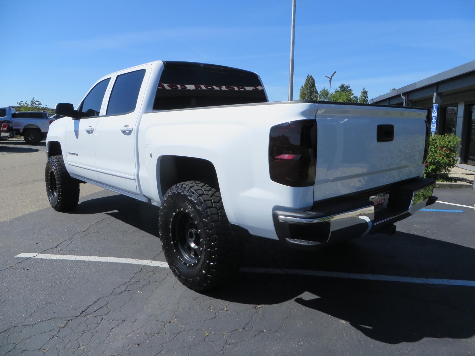 2018 White /BLACK Chevrolet Silverado 1500 LT (3GCPCREC7JG) with an 5.3L V8 OHV 16V engine, automatic transmission, located at 2630 Grass Valley Highway, Auburn, CA, 95603, (530) 508-5100, 38.937893, -121.095482 - Must see Pre Runner.... CST front lift spindals, Camburg UCA's, King Adjustable 2.5 Coil-overs, King 2.5 rear shocks, 35" Toyo RT Trail tires, 17" Method Race wheels, MZ front skid plate, G2 rear differntail cover, Full size bed mounted spare tire, Black Vinyl roof wrap, smoke tail lights and 3rd br - Photo #6